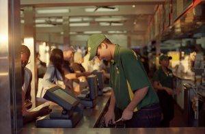A cashier taking a customer's money