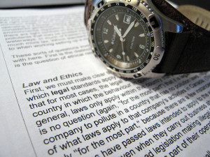 Law and Ethics Text with Watch