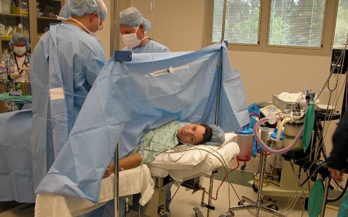 A woman receiving a C-section