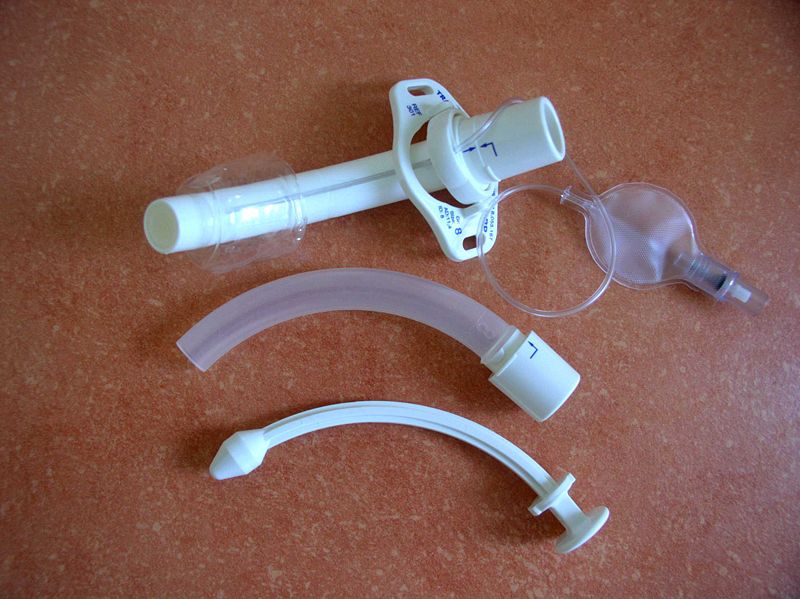 Photo showing parts of a tracheostomy tube