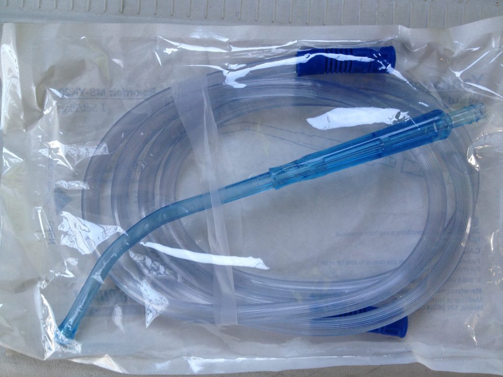 Photo showing a Yankauer Suction Tip, in clear plastic bag