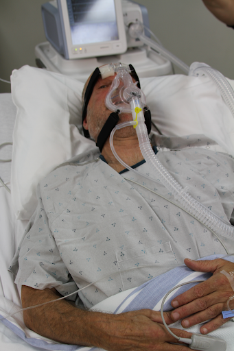 Photo showing a simulation of a patient wearing a BiPAP mask
