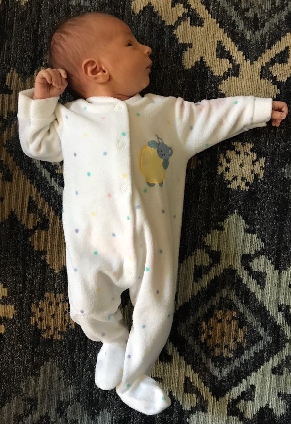 Photo of an infant display fencing posture, or tonic neck
