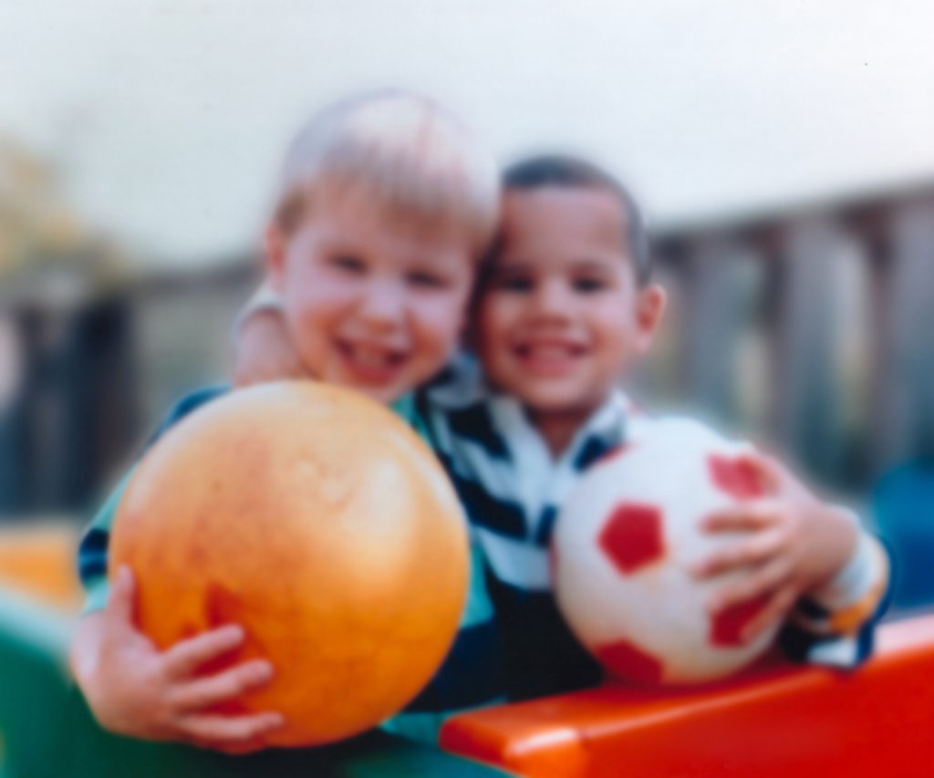 Photo showing two children, out of focus, to simulate vision with myopia