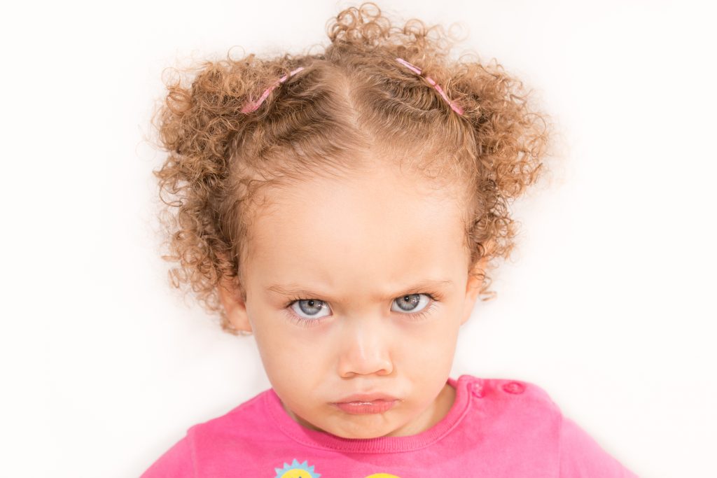 Photo showing a pouting toddler