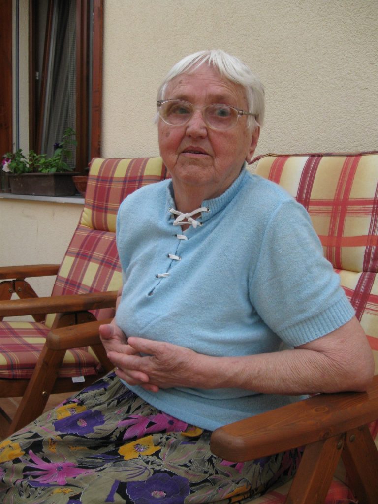 Photo of elderly woman sitting