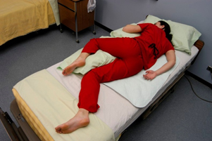 Image showing simulated patient in sims position