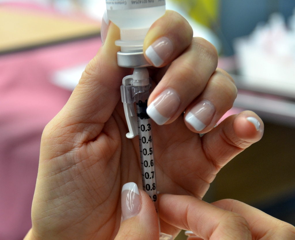 Photo showing a closeup of Withdrawing Medication from a Vial