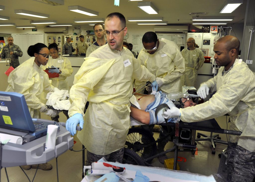 Photo showing medical personnel in a stressful health care enivronment
