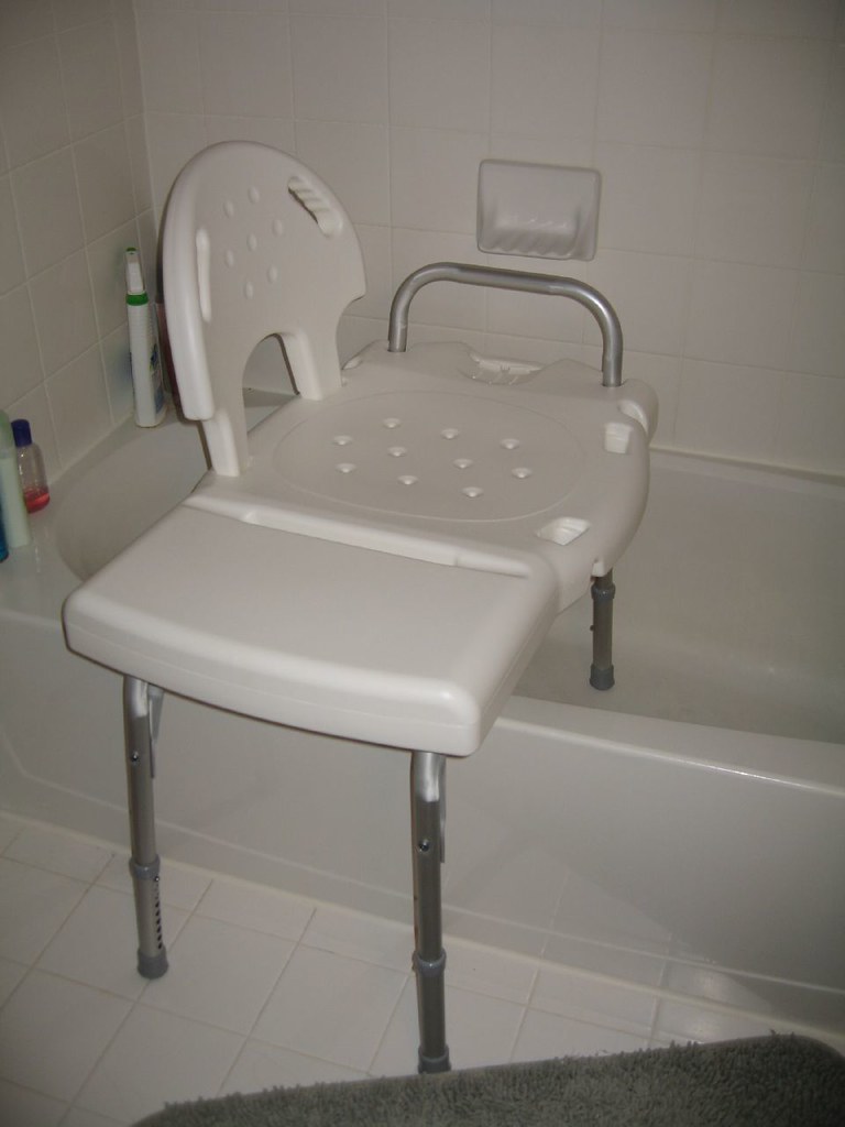 Photo showing a Shower Chair With Transfer Bench placed in a bathtub