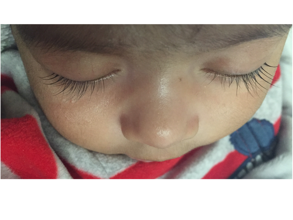 Photo showing a closeup of a young child's eyelashes