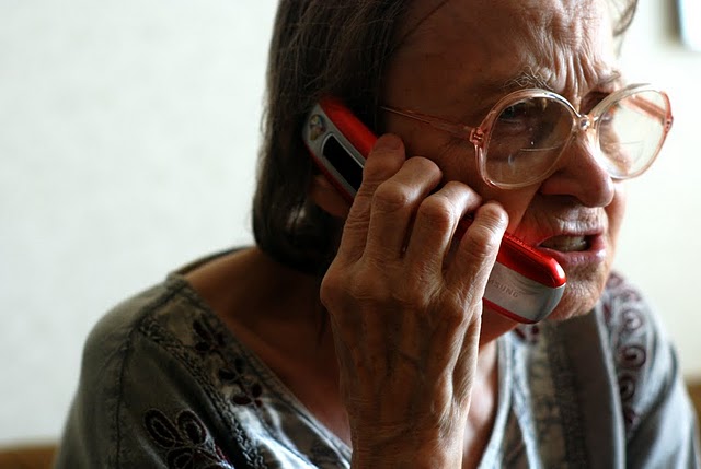 Photo showing an angry looking person talking on a cell phone