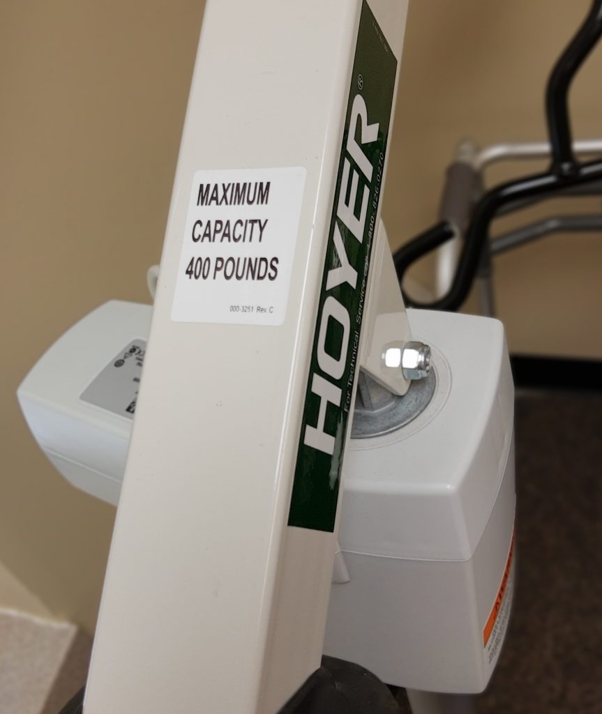 Photo showing a closeup of a weight capacity sticker on a mechanical lift