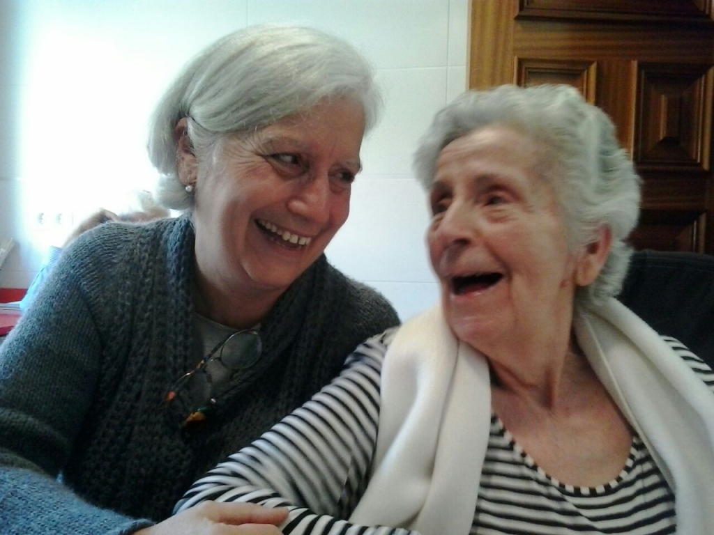 Photo showing an elderly mother and daughter smiling