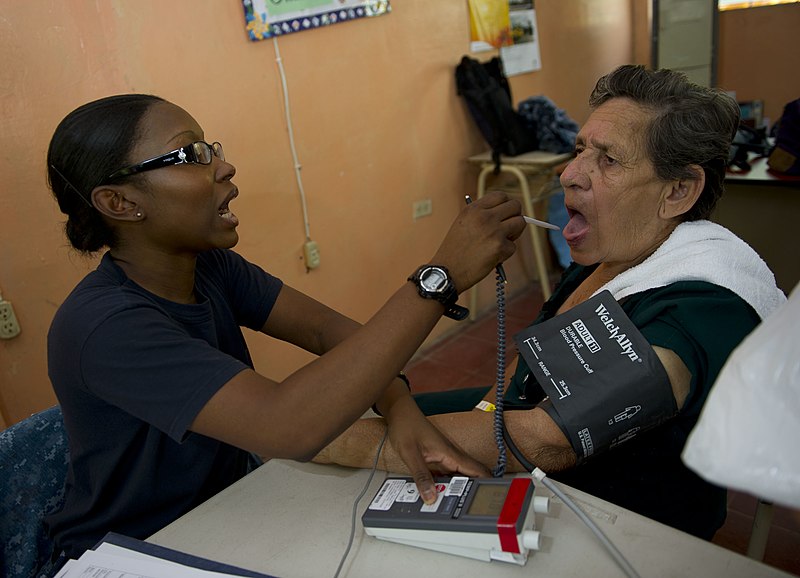 Photo showing a medical worker Obtaining Vital Signs from a patient