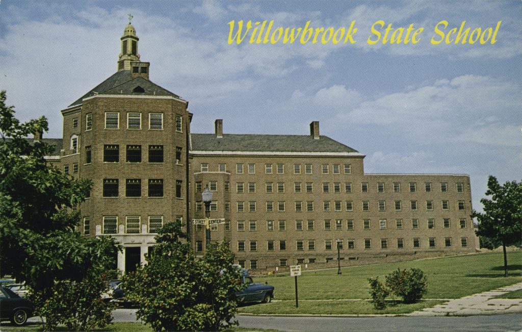Photo of a large building with text that reads Willowbrook State School