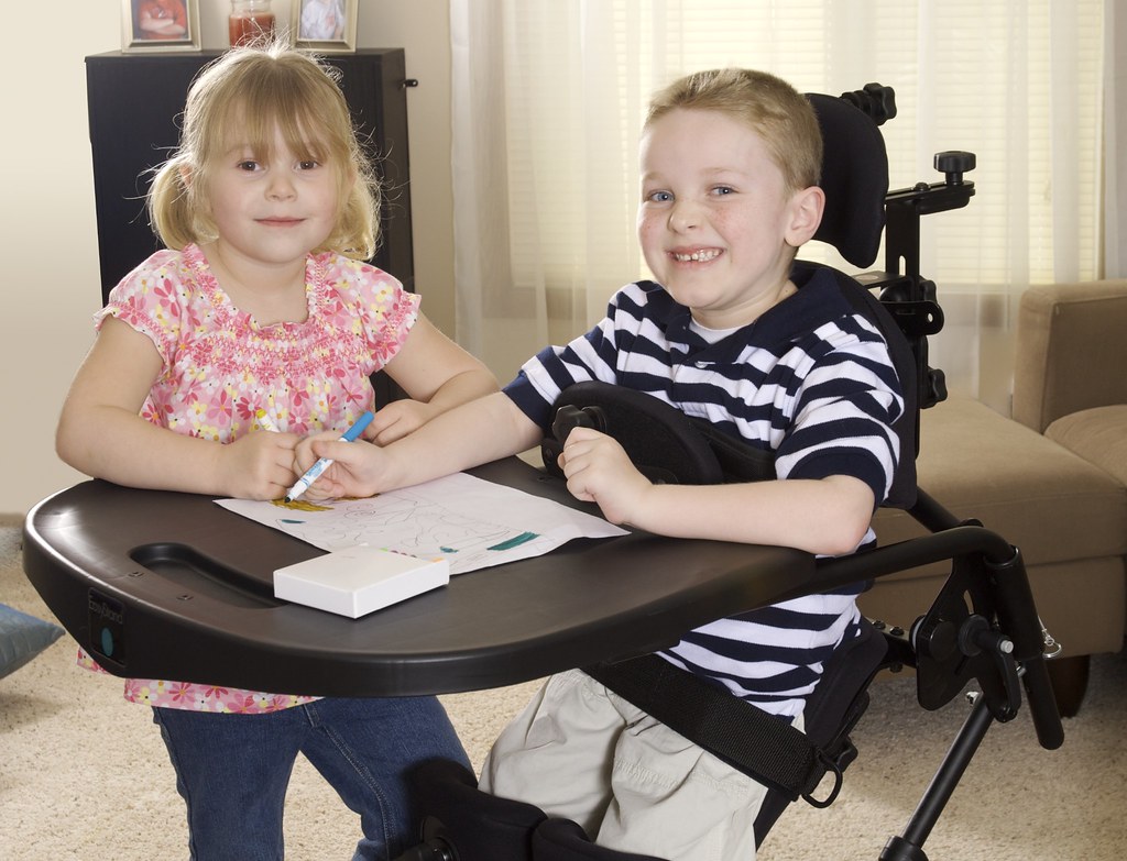 Image showing two children, one with MD in an EasyStand Wheelchair