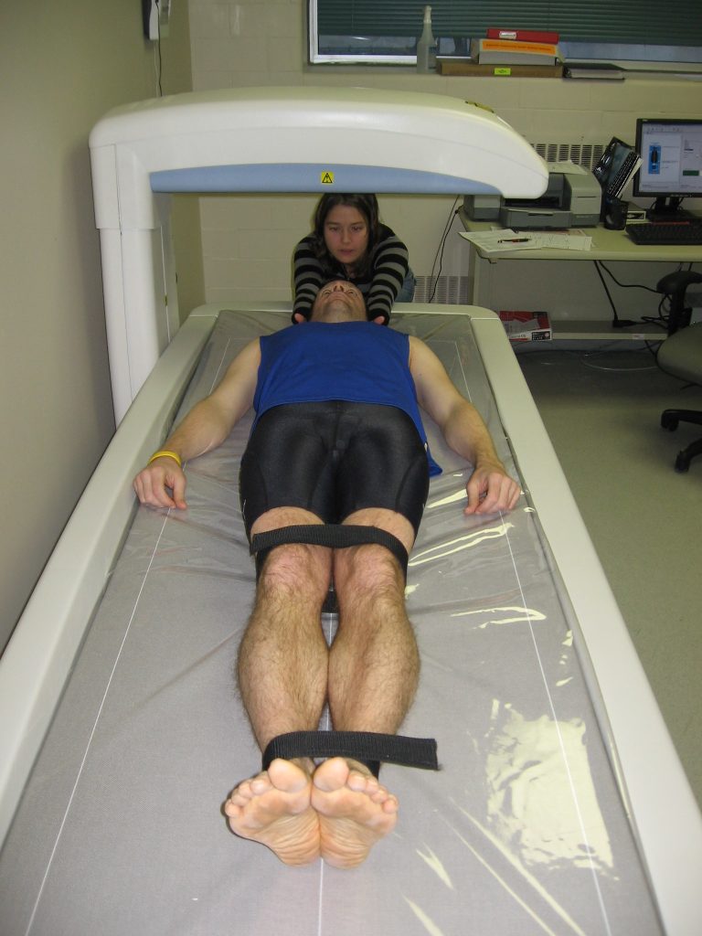 Image showing a patient being adjusted for a DEXA Scan