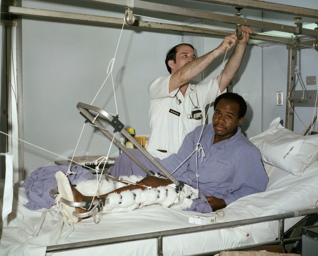 Image showing a patient being set up with traction on their medical bed