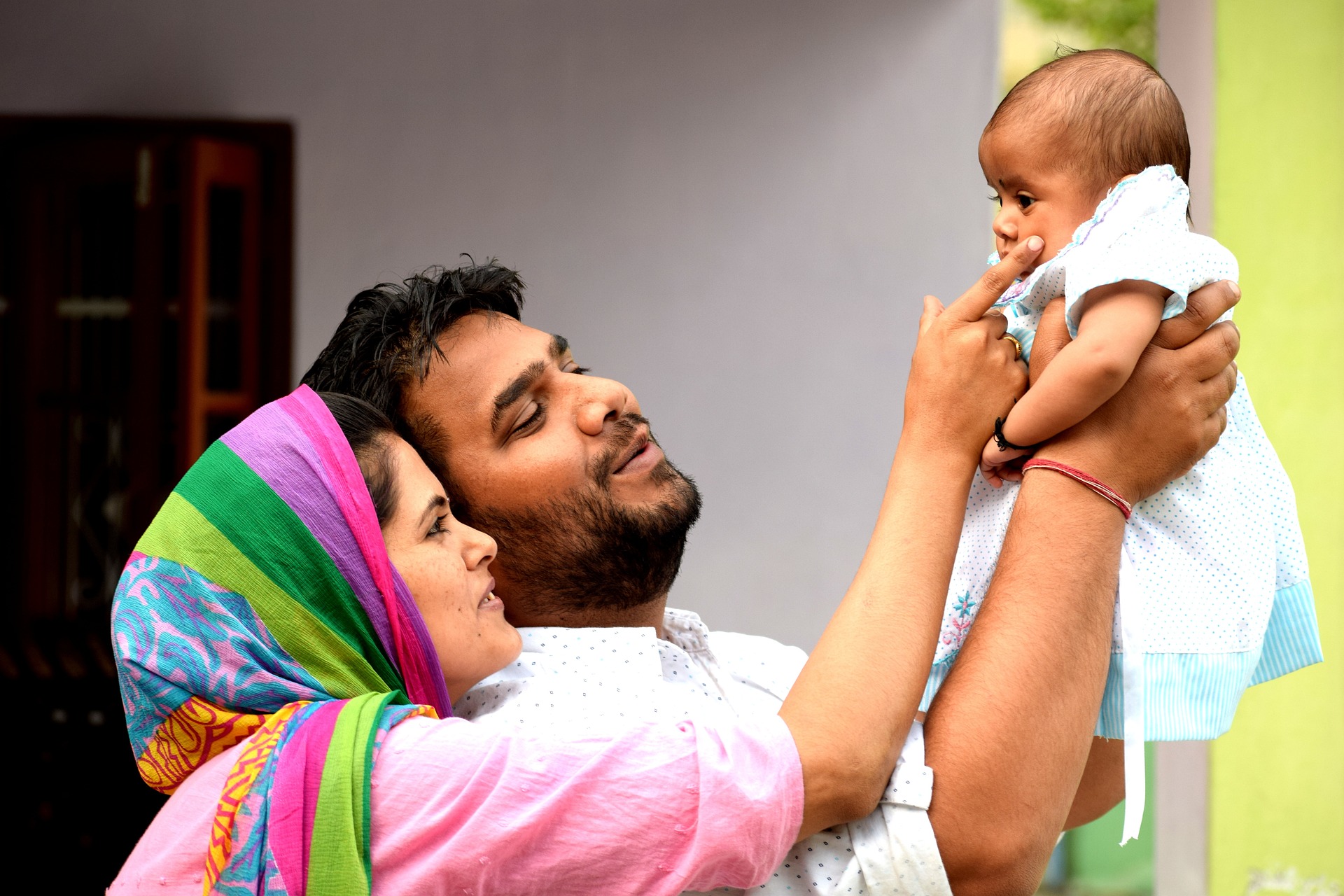 Image showing parents holding and interacting with a child