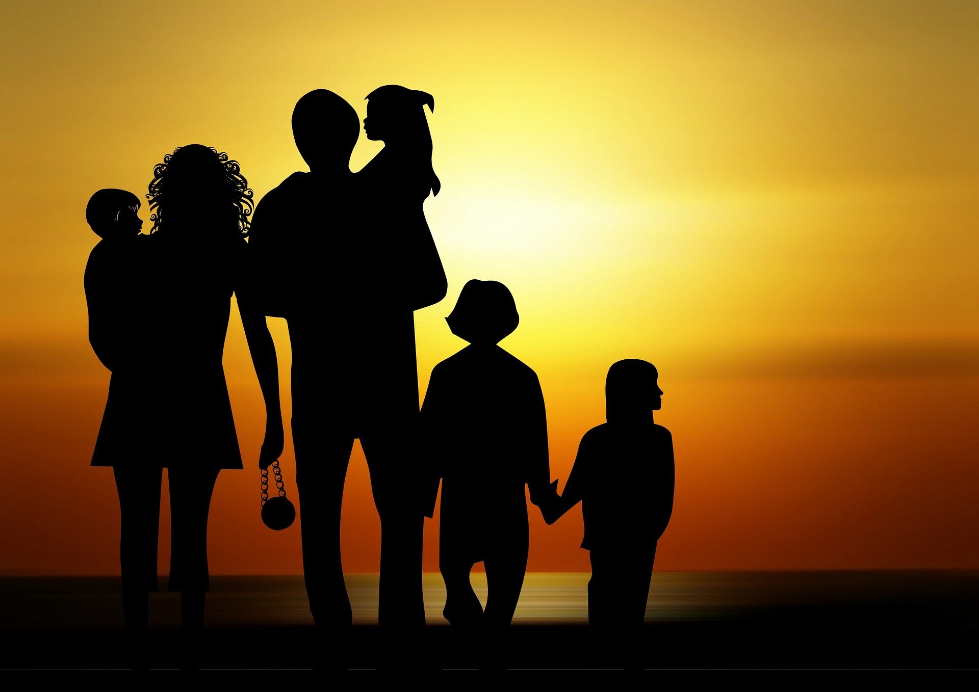 Image showing a simulated family silhouetted against a sunset background