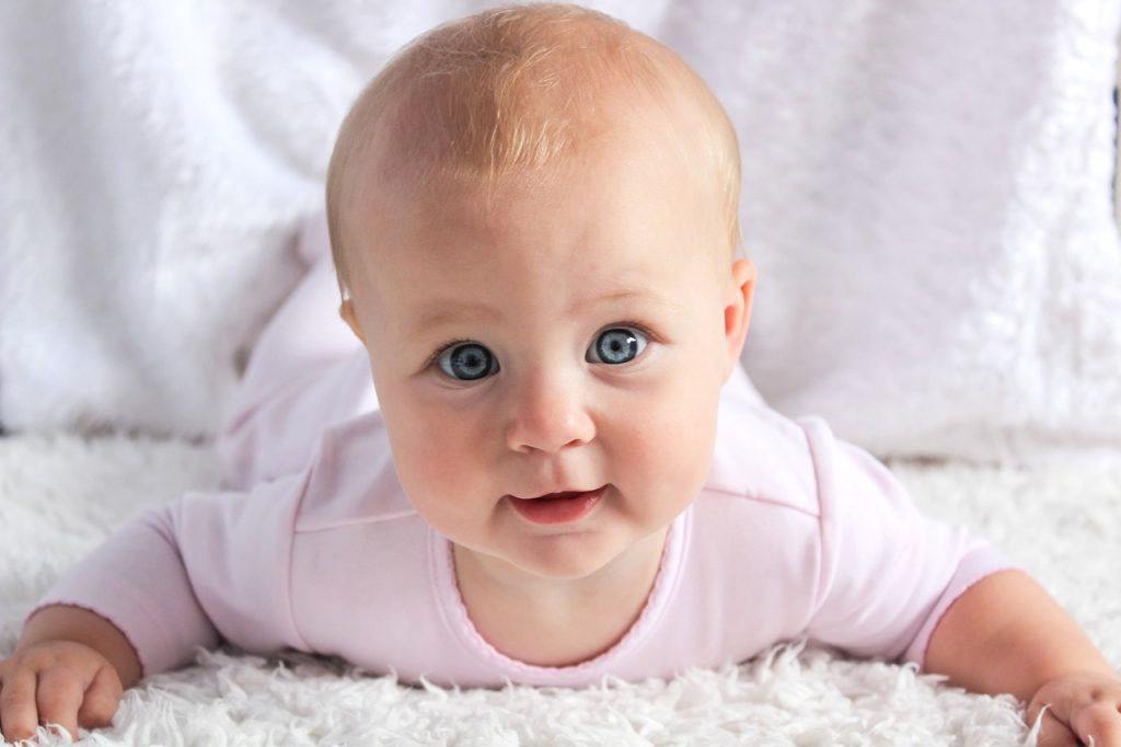 Photo showing a baby engaged in tummy time