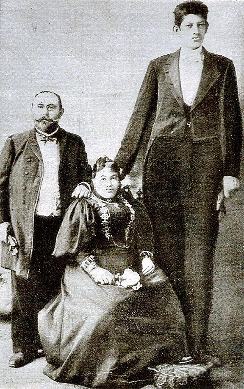 "Julius_Koch_Family_portrait.jpg" by unknown author is in the Public Domain. a portrait showing the Julius Koch family