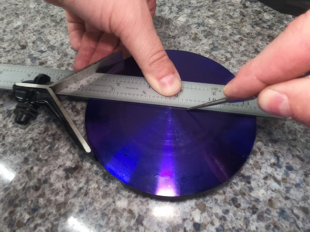 Hands shown using a scribe to create an accurate line on a part surface