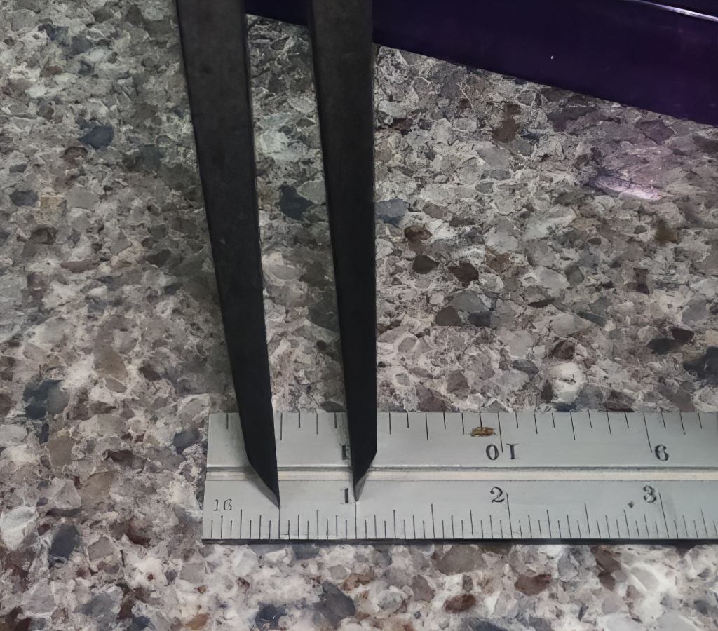 A ruler and a spring divider