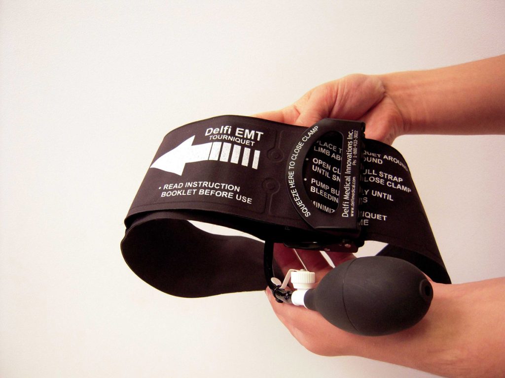 A Pneumatic emergency tourniquet with bladder and clamp for stopping traumatic hemorrhage