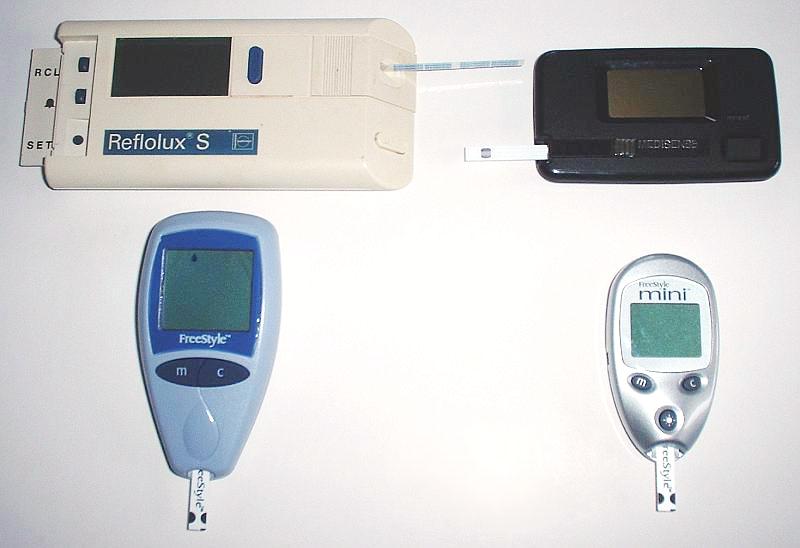 "Glucose_meters" by Christidy is in the Public Domain. Two blood glucose monitoring devices