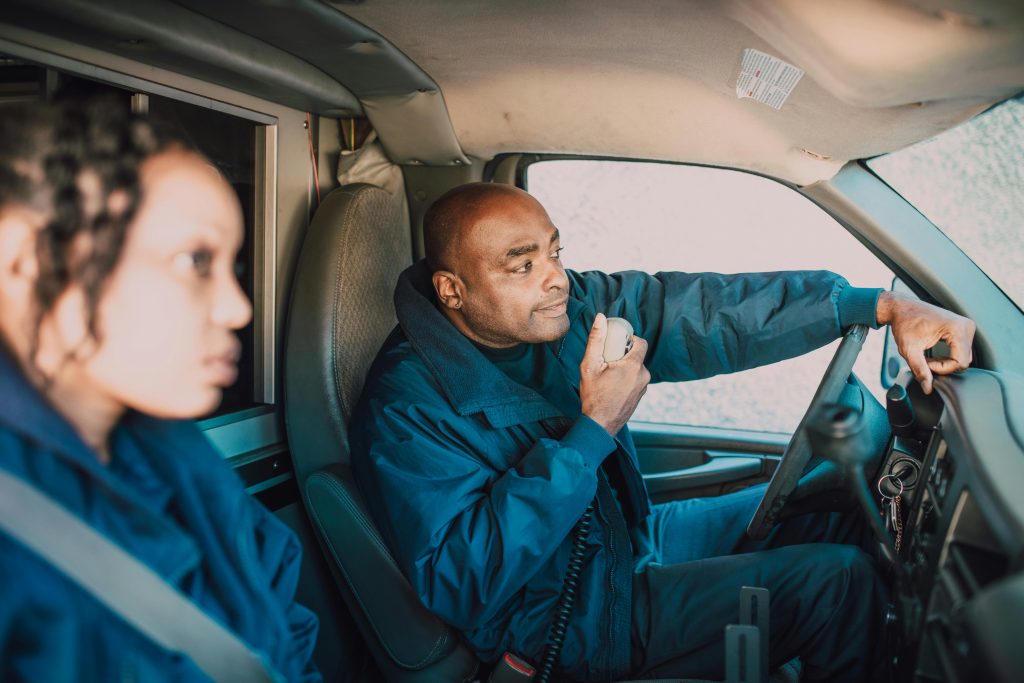 "pexels-rdne-6520108" by RDNE Stock Project, via Pexels.com is licensed under CC0 Two emergency personnel are sitting in the front of an ambulance