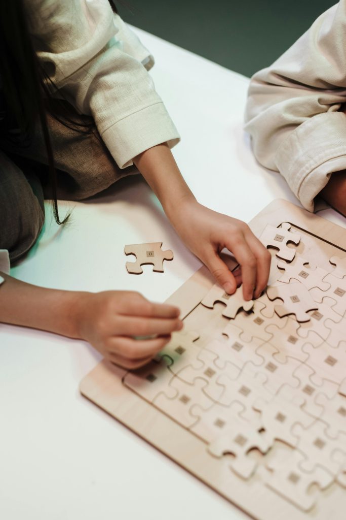 A person is putting together a puzzle